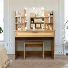 a wooden desk with lights on it in a white room next to a bed and window