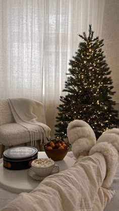 a living room with a small christmas tree