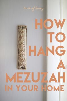 a door handle with the words how to hang a mezuzah in your home