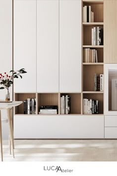 a living room filled with furniture and bookshelves next to a white dining table