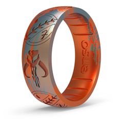 an orange and silver wedding ring with the word jesus on it