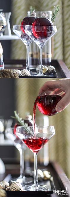 two glasses filled with red liquid being poured into them