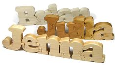 wooden letters spelling the word santa written in english and spanish, with an orange background