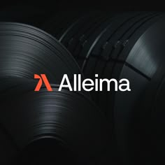 the logo for alleina is shown in front of stacks of steel wires and rolls