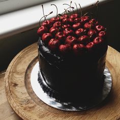 there is a chocolate cake with strawberries on top