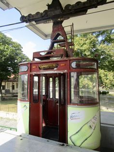 an old style trolley car sitting on the tracks