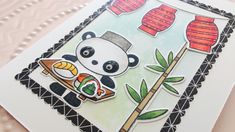 a card with a panda eating sushi and holding a chopstick in its hand