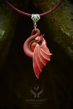 *Embrace fantasy and elegance with this Dragon necklace in pink and red hues. This handmade polymer clay pendant captures the spirit of dragons and is a perfect gift for fantasy lovers, Renaissance Faire enthusiasts or anyone who adores the allure of mythical realms. 🏰Embark on a journey into the realm of enchantment with this dragon necklace in pink and red tones! This beautiful dragon pendant will serve you not just as an accessory, but as a wise guardian and spirit companion! 🔮The fusion of pink and red hues symbolizes a fusion of passions and desires that transcend the boundaries of ordinary existence. In the world of magic, this combination  represents the alchemical reaction of emotions, merging the fiery ardor of red with the tender devotion of pink. This fusion embodies the spect Red Whimsical Jewelry For Gift, Whimsical Red Jewelry For Gift, Whimsical Red Jewelry For A Gift, Handmade Pink Fantasy Jewelry, Fantasy Polymer Clay Jewelry As A Gift, Handmade Polymer Clay Jewelry In Fantasy Style, Red Polymer Clay Jewelry For Gifts, Red Polymer Clay Jewelry For Gift, Fantasy Dragon Design Necklace