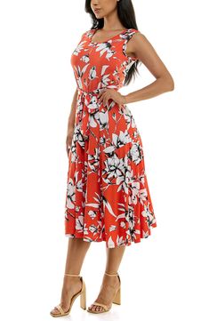 A vibrant printed midi dress is perfect for summer events. Fit: this style fits true to size. 50" length (size Medium) Crewneck Sleeveless Attached waist tie 95% polyester, 5% spandex Machine wash cold Imported Model stats: 5'10", 32" bust, 25" waist, 36" hip. Model is wearing size Medium. Summer A-line Printed Midi Dress, Printed Knee-length Midi Dress For Summer, Printed Knee-length Summer Midi Dress, Summer Knee-length Printed Midi Dress, Printed Knee-length Maxi Dress For Summer, Printed Summer Maxi Dress, Printed Midi Length Floral Summer Dress, Printed Floral Midi Dress For Summer, Casual Fit And Flare Sleeveless Summer Dress