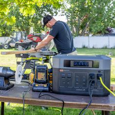 a man is working on some equipment in the yard