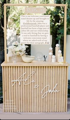 a sign that says it's ok on the side of a wooden table with flowers