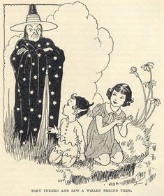 an old book with children dressed up as wizard and witch in the grass, one child is