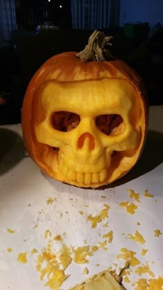 a pumpkin carved to look like a skull