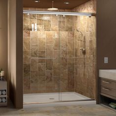 a walk in shower sitting next to a sink