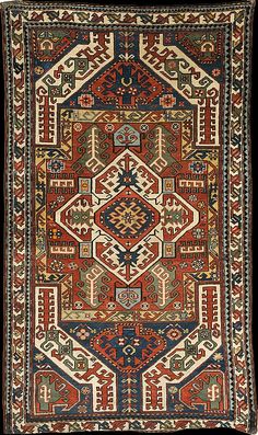 an old rug with many different colors and designs on the sides, including geometric shapes