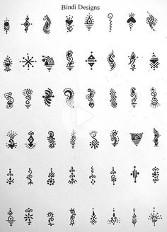 some type of ornamental designs on a white sheet with black ink in the middle and bottom