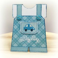 a card with a blue car on it and the words baby boy written in white