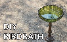 a birdbath sitting on top of a cement ground with the words diy birdbath above it