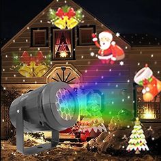 an outdoor christmas light projector in front of a house