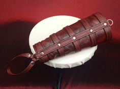 Red & Brown Leather belted Arm Gauntlet with hand belt. This steampunk gauntlet is made from premium quality bovine leather. Size : Fits from wrist size 160mm to forearm 225mm. Overall length 270mm Dear customer - Delivery times during the Global Corona Lockdowns are taking much longer than normal. Please keep this in mind when placing your orders as we have no control over shipping delays. We have however had every parcel delivered so far, it just a little longer. Should you wish to ship yo Steampunk Gauntlet, Arm Gauntlet, Brown Leather Belt, Wrist Cuffs, Leather Collar, Purple Roses, Adult Costumes, Red Brown, Leather Belt