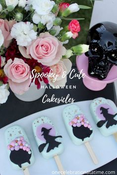 halloween cake pops decorated with black cat and pink flowers