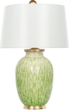 a green lamp with a white shade on the base and a gold trim around it