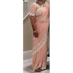 Good Condition, Worn Just Once. Modern Pastel Peach Saree With White Dana Moti Work. This Is A Well Made And Heavy Saree, Fit For Weddings, Bridal Wear, Sangeet, Diwali, Mehendi And Haldi. Handmade In India. Fall And Pico Done. Few Markings From Tailor's Chalk. Comes With Petticoat And Blouse. Dress For Function, Diwali Mehendi, Heavy Saree, Moti Work, Peach Saree, India And Pakistan, Petticoat, Bridal Wear, Traditional Outfits