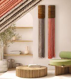 a living room with two wall hangings on the wall and a coffee table in front of it