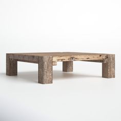 a wooden table sitting on top of a white floor