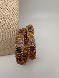 Matte CZ Multi Stone Elephant Pattern Bangles. It comes as a Pair. Please measure your size before ordering as we don't accept returns. Perfect gift for your loved ones, Comes in a gift Box. Ready to ship from Boston, Massachusetts. If you have any questions please let me know. Thank you!! Antique Necklace Victorian, Cz Bangles, Traditional Bangles, Indian Bangles, Real Pearl Necklace, Bangles Indian, Traditional Earrings, Green Stones, Bangles Bracelets