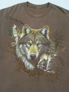 "1990s wolf t-shirt montage of lone green eyed wolf no tag cotton feel brown w/colors good vintage condition soft, faded, fray most like large, see below measures. lying flat, shoulder-20\" chest-22\" sleeve-7 1/2\" length-29 1/2\"" Gary Smith, Epic Clothes, Geeky Clothes, Wolf Shirt, Nature Shirts, Wolf T Shirt, Wolf Girl, Long Sweaters Cardigan, Silly Cats