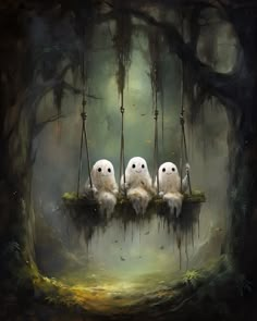 three white owls sitting on a swing in the forest