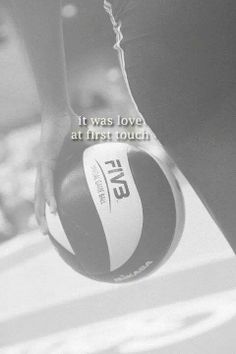 a person holding a basketball in their hand with the words it was love at first touch