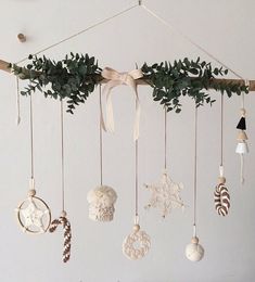 an assortment of ornaments hanging from a branch