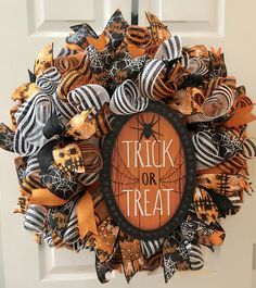 a halloween wreath that says trick or treat