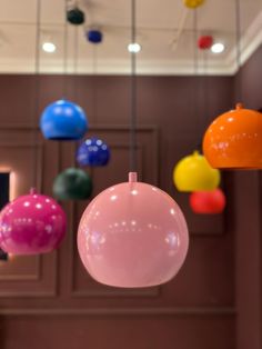 colorful balloons hanging from the ceiling in a room