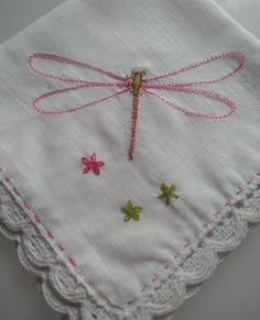 Love dragonflies and hankies too?  So do I.  I love to stitch 'em, I love to use them and I love to give them!   Stitch this beautiful dragonfly on a crochet edge hankie with this kit.  It's pure airy loveliness. See my new approach to this pretty pattern....White on white!  Lovely.   Kit includes a high quality, 100% cotton hankie, an easy to use stick-on embroidery pattern, and embroidery instructions complete with pictures.  The instructions tell you which stitches to use, how many strands of What To Do With Embroidery Thread, Embroidery Edges Ideas, Small Simple Embroidery Ideas, Cute Embroidered Shirts, Easy Things To Hand Sew, Embroidery Designs Aesthetic, How To Do Embroidery, Easy Embroidery Designs For Beginners, How To Embroider Beads