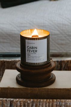 a candle sitting on top of a wooden box