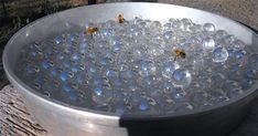 a metal bowl filled with lots of bubbles