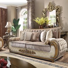 a living room filled with furniture and a large mirror on the wall above it's headboard