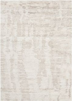 an area rug with white and beige colors