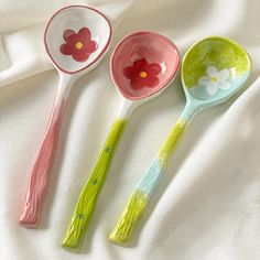 three spoons with flowers painted on them