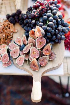 figs and other fruits are on a table