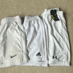 Adidas And Nike Pairs Are Women's Small, Under Armour Pair Is Men's Size Small. Each Pair Is Listed Individually In My Closet-- Check Out Each Listing For More Details Or To Buy A Single Pair Adidas: Never Worn To Play, Just Tried On And Didn't Fit! Size S But Could Fit A Small Or Medium In My Opinion! Nike: Gently Used- Small Dots/Stains As Seen In The Pictures, But They Really Can't Be Seen From Afar. Under Armour: Brand New, With Tags Attached White Adidas Sports Shorts, Adidas Sporty White Athletic Shorts, White Moisture-wicking Shorts, Adidas White Athletic Shorts With Moisture-wicking, Adidas White Sports Shorts, Adidas White Cotton Athletic Shorts, Adidas White Sporty Shorts, Adidas White Casual Shorts, Adidas Casual White Shorts