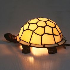 a turtle lamp sitting on top of a table