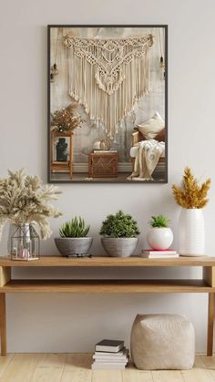 a wooden table topped with bowls filled with plants next to a wall mounted art piece