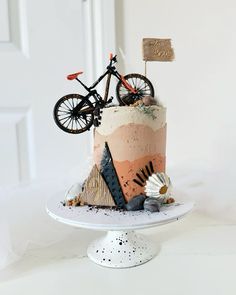 a bike is on top of a cake