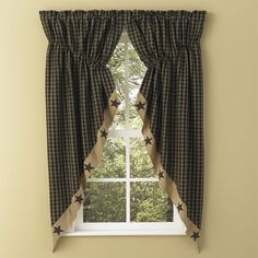 a window with black and white checkered curtains, stars on the valance, and one curtain at the top