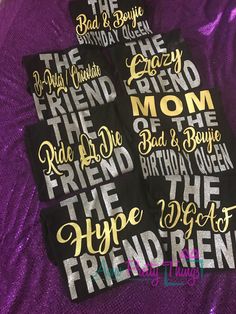 some black and gold stickers are on a purple sheet with the words happy birthday