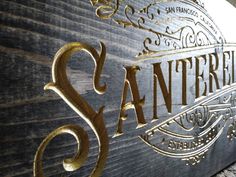 the sign for san francisco is gold and black with intricate designs on it's sides